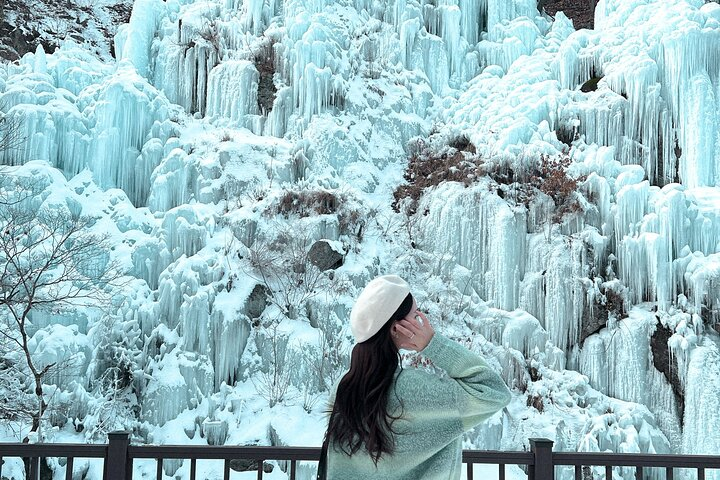Experience the serene beauty of Eobi Ice Valley with stunning ice formations as the backdrop for your winter adventure. Perfect for capturing unforgettable moments in a magical winter landscape.